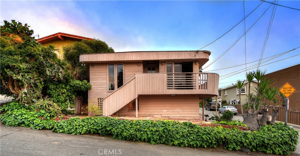9th Avenue view of entry stairway and wrap around deck. - 31906 9th Avenue, Laguna Beach CA 92651 - photo 1