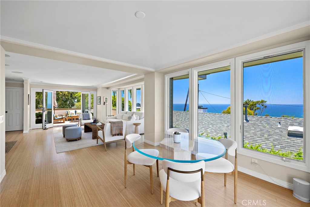 Beautiful, newly refinished bamboo flooring runs throughout the upper level. - 31953 10th Avenue, Laguna Beach CA 92651 - photo 10