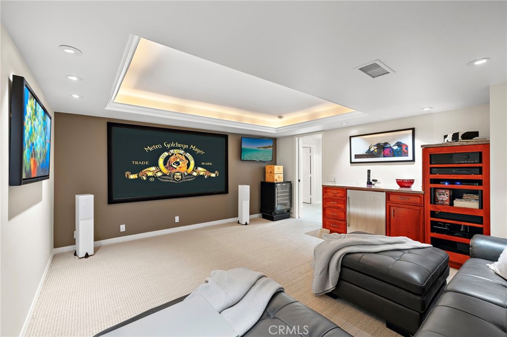 A flexible bonus room with custom built-ins is currently enjoyed as a media room and offers a dedicated space for movie - 31953 10th Avenue, Laguna Beach CA 92651 - photo 33