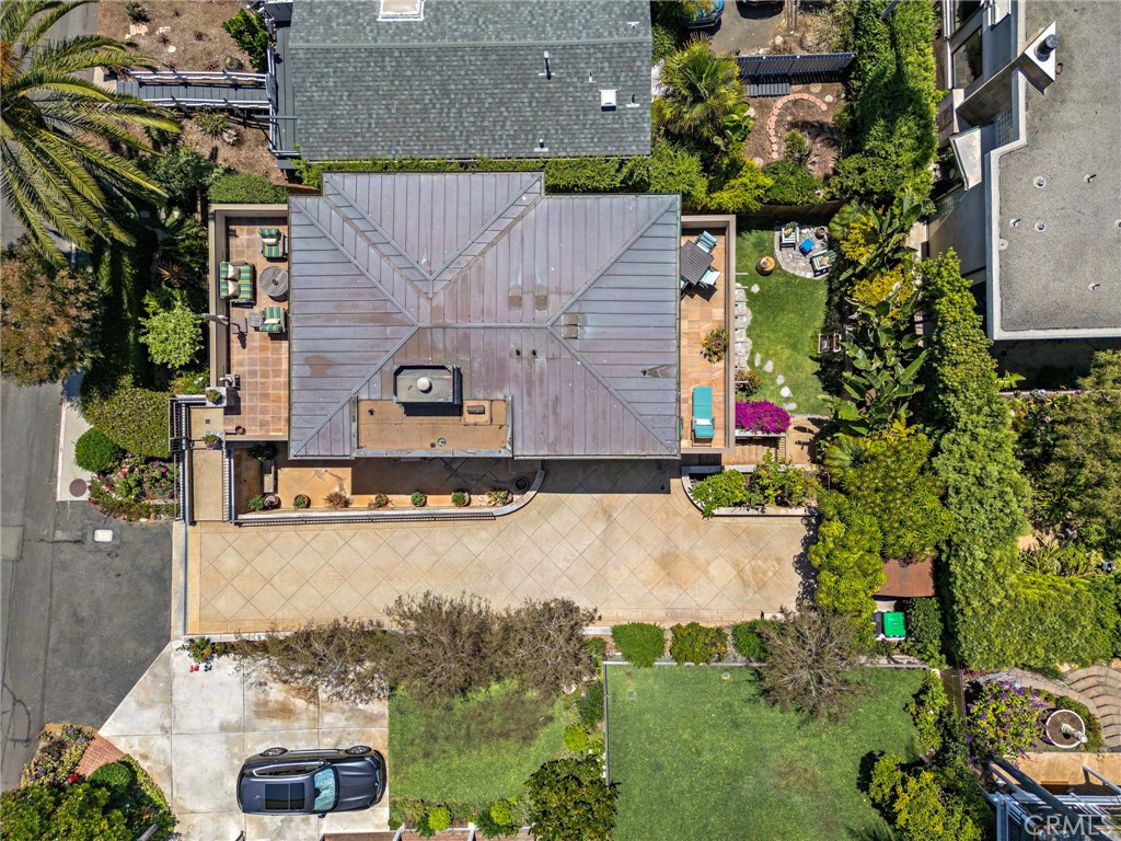 Aerial shot of the property shows the oversized driveway with parking for five cars in addition to the attached two-car - 31953 10th Avenue, Laguna Beach CA 92651 - photo 40