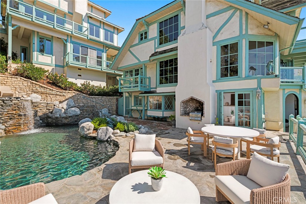The poolside guest quarters feature ocean views, a fireplace, and an ensuite bath. - 31971 Coast Highway, Laguna Beach CA 92651 - photo 14
