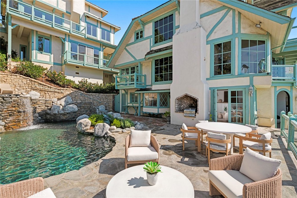 The poolside guest quarters feature ocean views, a fireplace, and an ensuite bath. - 31971 Coast Highway, Laguna Beach CA 92651 - photo 15