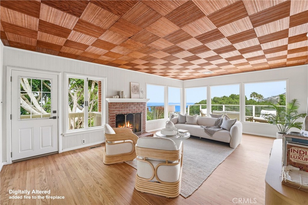 Front door entry, Spacious Living Room with hardwood floors, Fireplace and ocean views - 32021 & 32001 sunset Avenue, Laguna Beach CA 92651 - photo 8