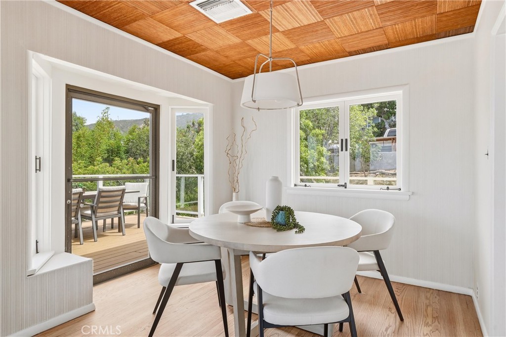 Dining room with access door to balconu,spectacular ocean, hills, trees views - 32021 & 32001 sunset Avenue, Laguna Beach CA 92651 - photo 11