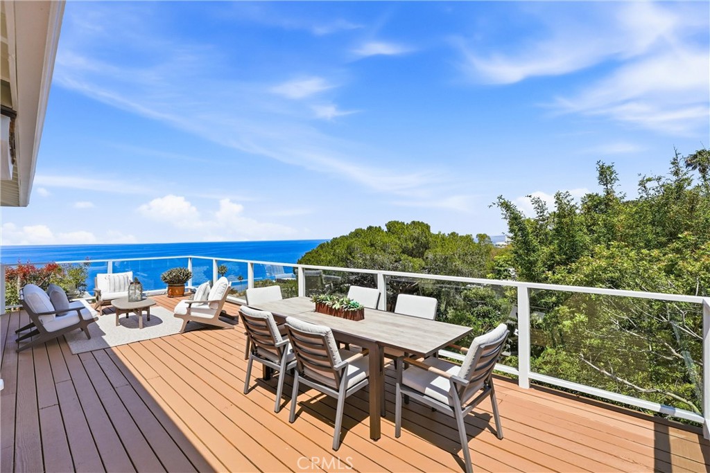 Spacious Balcony with panoramic ocean views, sunset, hills and trees, glass enclosures for outdoor living and entertaini - 32021 & 32001 sunset Avenue, Laguna Beach CA 92651 - photo 15