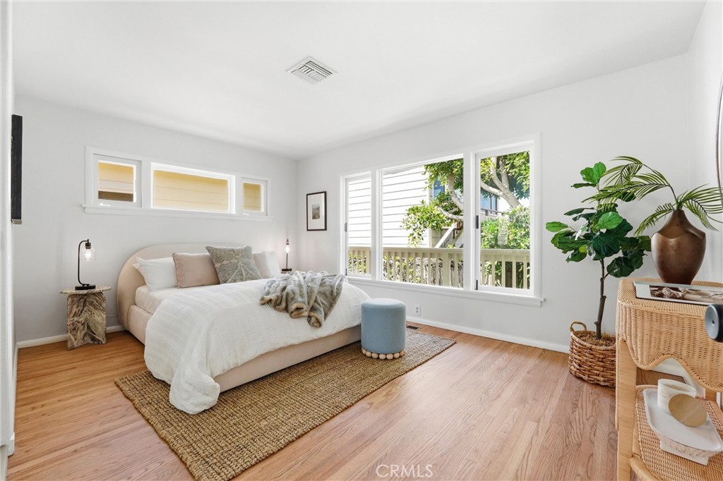 Main bedroom at main level with hardwood floors - 32021 & 32001 sunset Avenue, Laguna Beach CA 92651 - photo 20