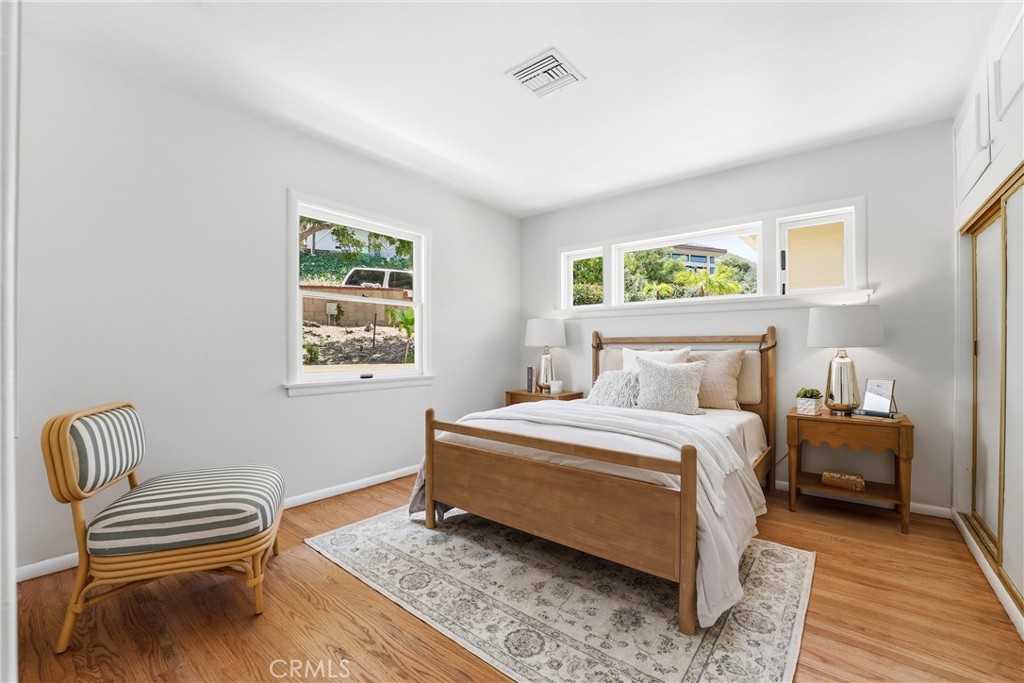 Bedroom #2 at main level with hardwood floors, closet, hills views - 32021 & 32001 sunset Avenue, Laguna Beach CA 92651 - photo 22