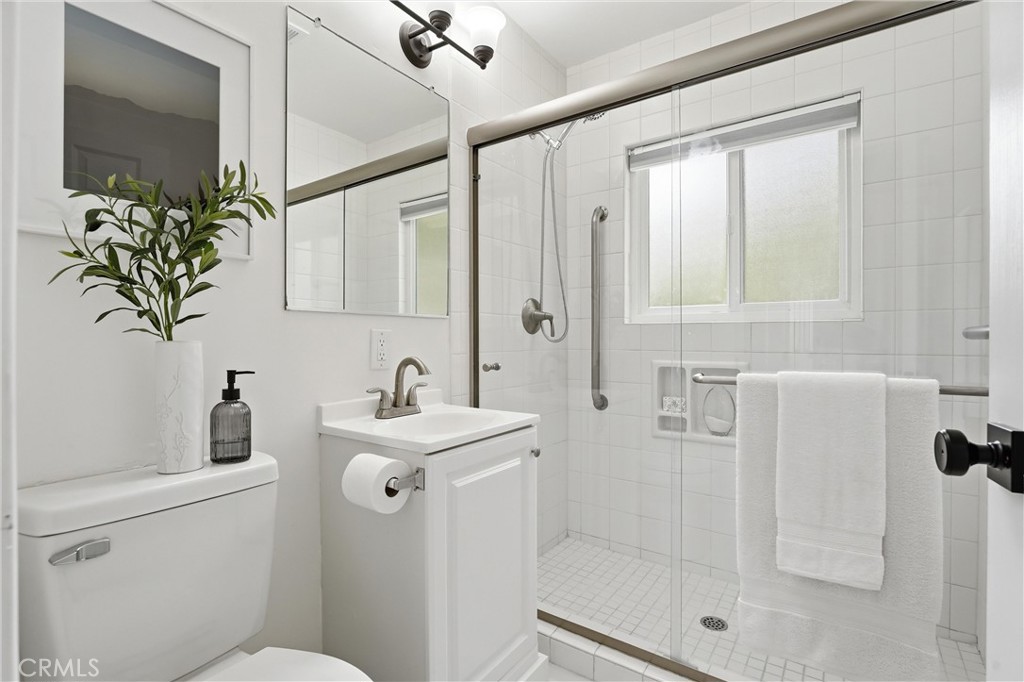 Main floor bathroom with tiled floors, newly remodeled and upgraded - 32021 & 32001 sunset Avenue, Laguna Beach CA 92651 - photo 24