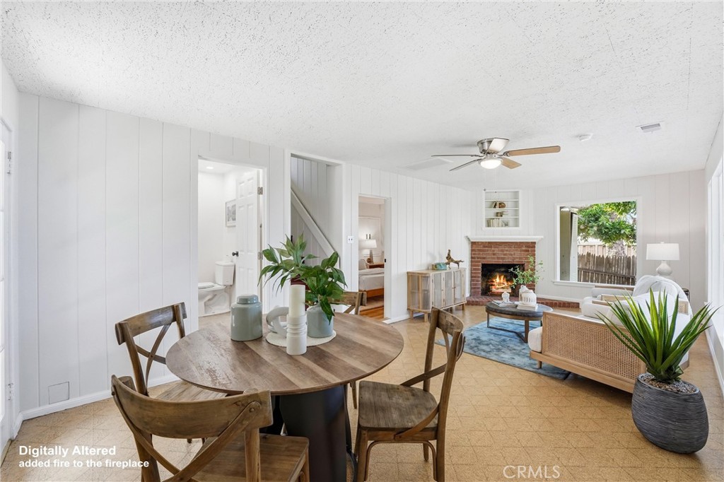 Spacious Living room, dining area with ceiling fan/lights at lower level plus Fireplace - 32021 & 32001 sunset Avenue, Laguna Beach CA 92651 - photo 28