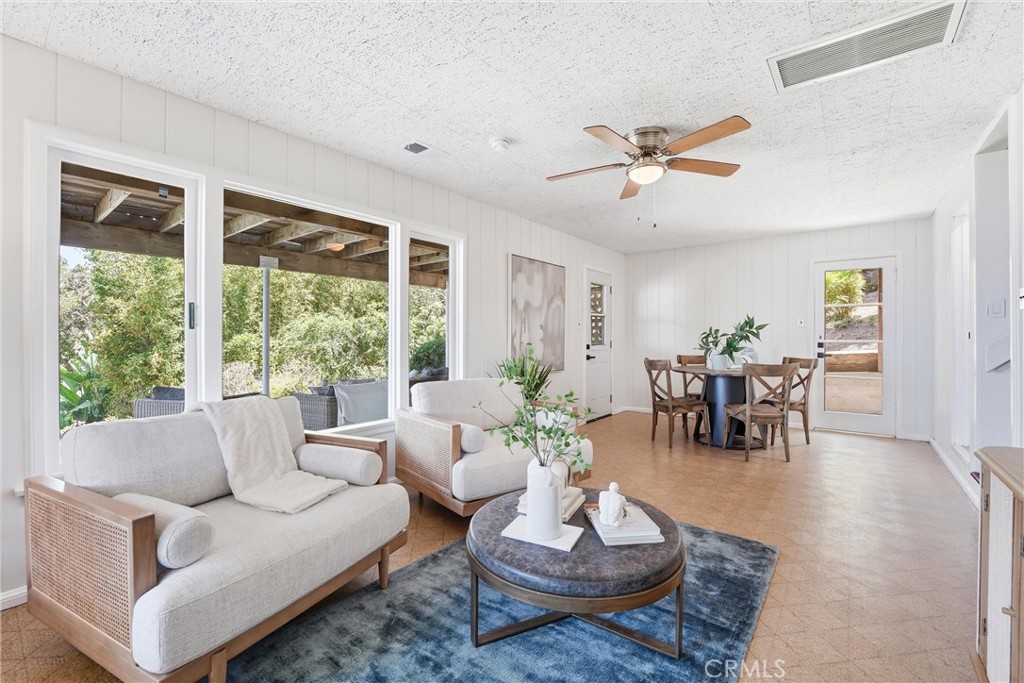 Lower level Living areas with access door to back covered Patio/deck with ocean views - 32021 & 32001 sunset Avenue, Laguna Beach CA 92651 - photo 31