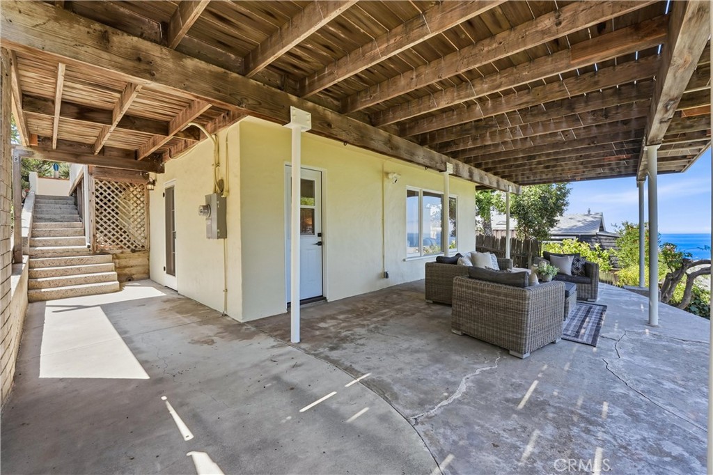 Lower level with stairs to Main level, spacious Deck and access door to Living areas - 32021 & 32001 sunset Avenue, Laguna Beach CA 92651 - photo 33