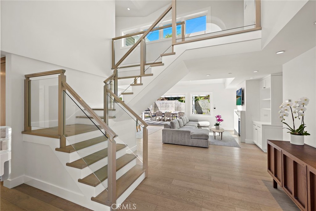 Enter into soaring ceilings and a light-filled living room, with stunning skylights, custom built-ins, and one of the ho - 3203 Tyrol Drive, Laguna Beach CA 92651 - photo 6