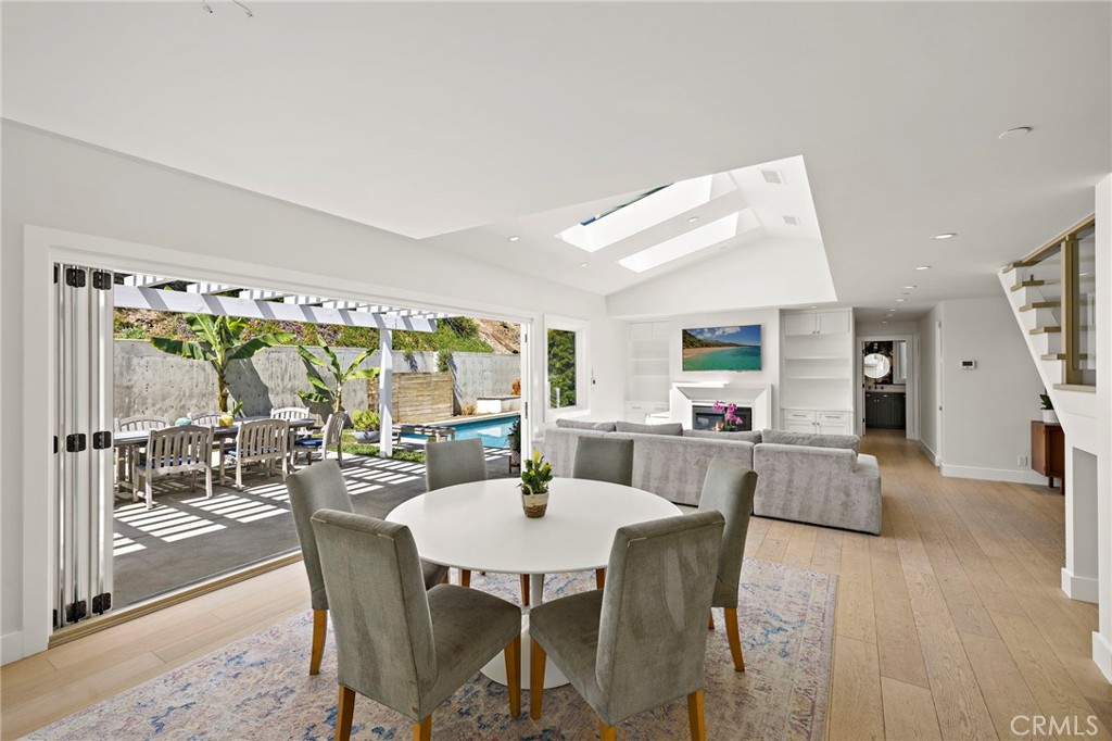 Bi-fold doors connect the space to the backyard, creating a seamless indoor/outdoor flow - 3203 Tyrol Drive, Laguna Beach CA 92651 - photo 9