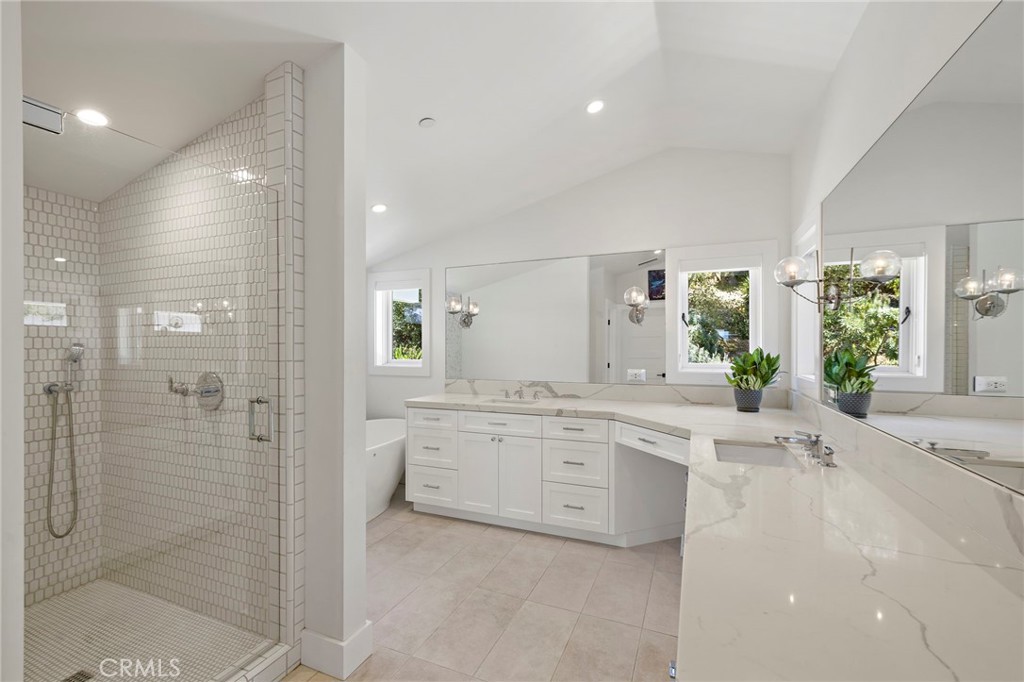 The spa-inspired primary bath includes a freestanding soaking tub and a separate walk-in shower. - 3203 Tyrol Drive, Laguna Beach CA 92651 - photo 25