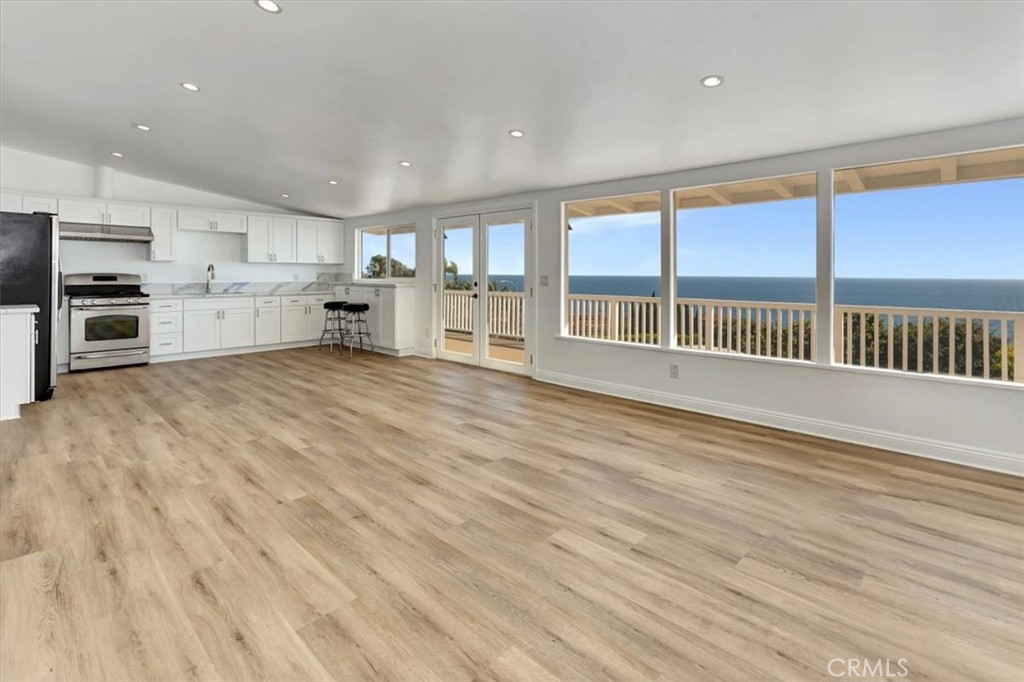 View to the kitchen and dining areas. - 32122 Coast Hwy, Laguna Beach CA 92651 - photo 7