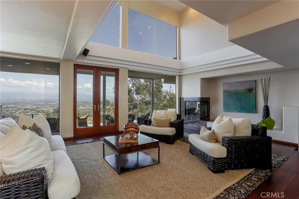 Two-story living room facing the mountains and valley. - 3216 Tyrol Drive, Laguna Beach CA 92651 - photo 1