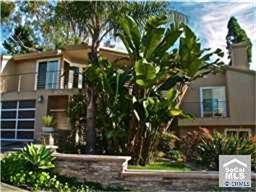 Front of home with lush tropical landscaping. - 325 MOSS Street, Laguna Beach CA 92651 - photo 1