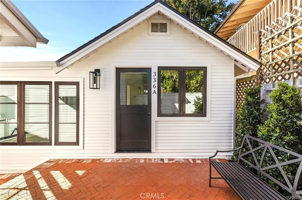 This industrial cottage sits behind a gate for maximum privacy. - 336 Myrtle Street A, Laguna Beach CA 92651 - photo 1