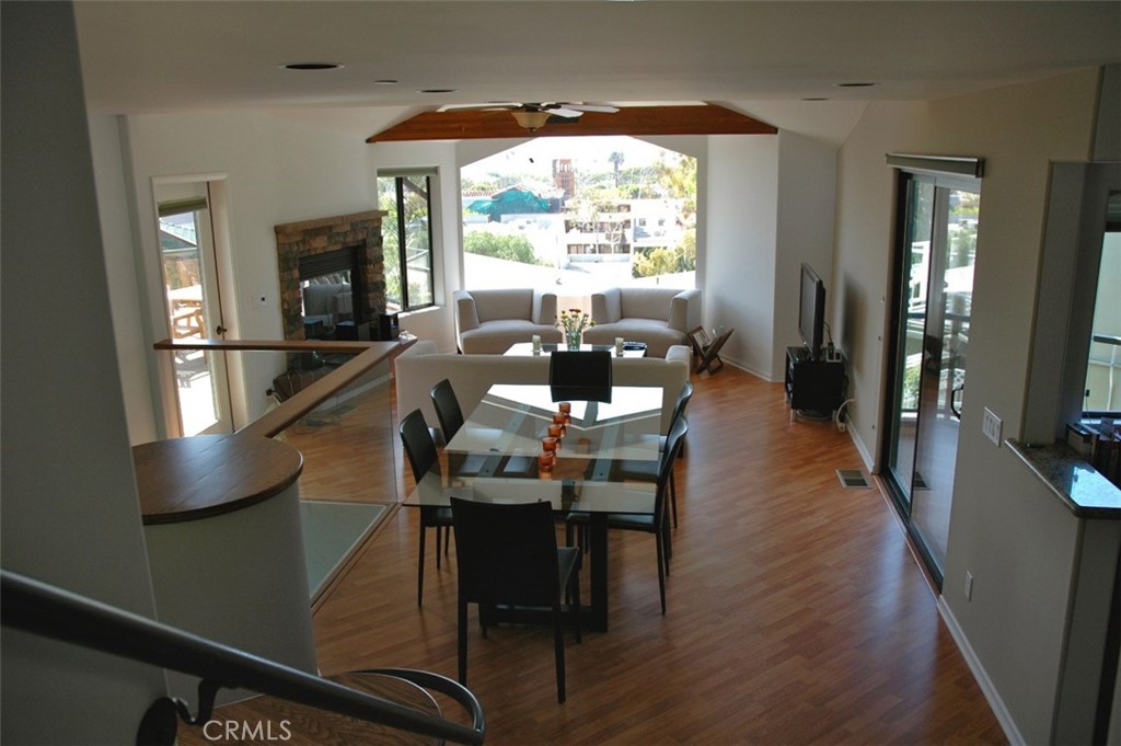 Living room views of downtown and the ocean. Large, attached deck to the left of the fireplace. - 338 Y Place A, Laguna Beach CA 92651 - photo 1
