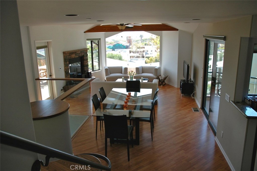 Living area, fireplace, view of downtown from master stairway (shown furnished, not rented as furnished) - 338 Y Place, Laguna Beach CA 92651 - photo 1