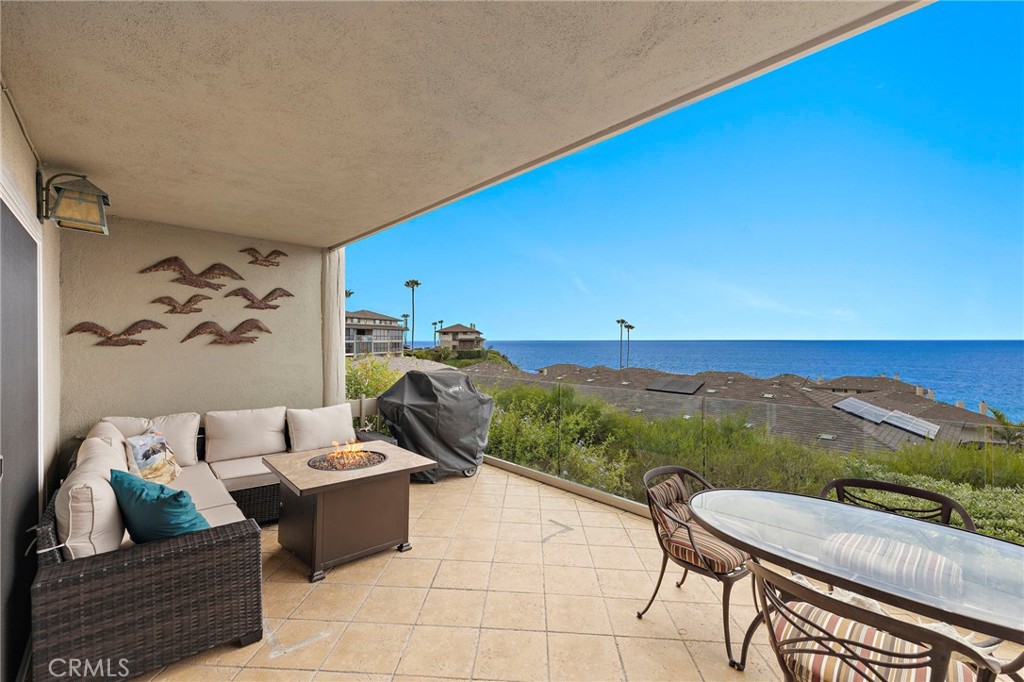 ENJOY OUTDOOR DINING ON GROUND FLOOR PATIO WITH FIREPIT AND BBQ. - 34 Blue Lagoon, Laguna Beach CA 92651 - photo 4
