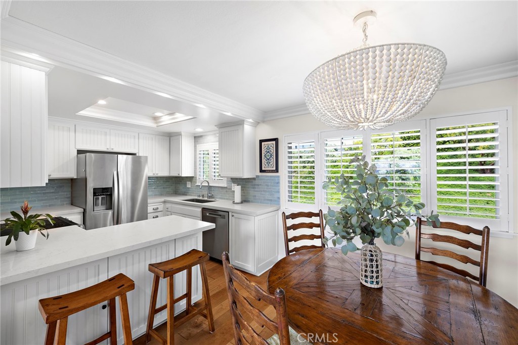 DINING AREA AND BREAKFAST BAR. ALL NEW KITCHEN APPLIANCES. - 34 Blue Lagoon, Laguna Beach CA 92651 - photo 9