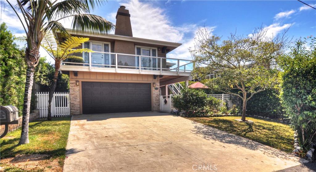 Beautiful 1998 rebuilt home with quality craftsmanship and attention to detail. 2 car attached garage with a driveway is - 361 Bluebird Canyon Drive, Laguna Beach CA 92651 - photo 1