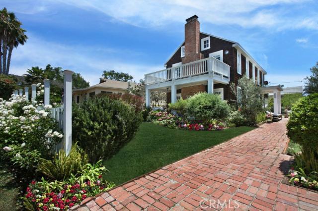 Sitting on one of the prettiest streets in North Laguna Beach. The flat lot is over 6,000 sq. feet. - 369 Hawthorne Road, Laguna Beach CA 92651 - photo 1