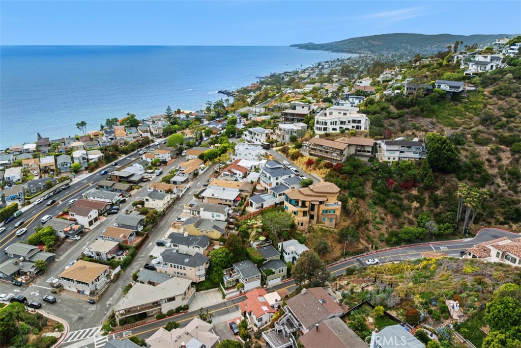 You are facing North on Coast Hwy. Please note, this image shows two lots. Lot for sale is closest to the ocean. Fencing - 375 Nyes Place, Laguna Beach CA 92651 - photo 6