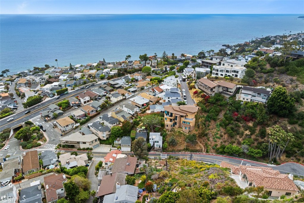 Please note, this image shows two lots. Lot for sale is closest to the ocean. Fencing in front shows the lot for sale. - 375 Nyes Place, Laguna Beach CA 92651 - photo 7