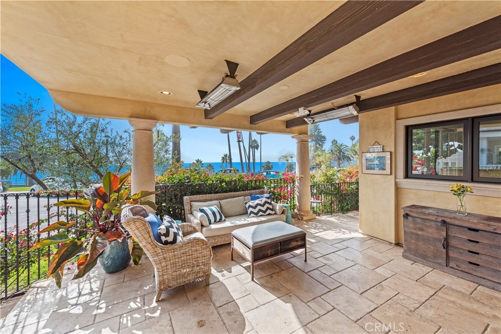 Street level, single level end unit with wrap around front and side porches/patio. - 386 Cliff Drive, Laguna Beach CA 92651 - photo 1