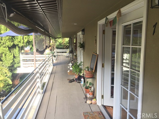 Front door from balcony - 387 Cypress Drive 7, Laguna Beach CA 92651 - photo 1