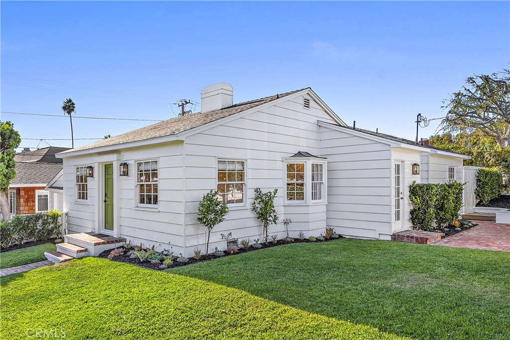 Front and side of property with wrap around yard on a corner lot. - 390 Mountain Road, Laguna Beach CA 92651 - photo 1