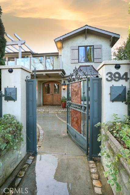 Enter 394 Poplar through 18th Century Antique Gates into private courtyard with fountain and gorgeous gardens. - 394 Poplar Street, Laguna Beach CA 92651 - photo 1
