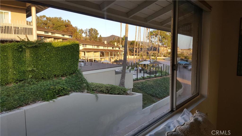 VIEW FROM GUEST BEDROOM LOOKING AT UPPER COMMUNITY POOL AREA - 40 Blue Lagoon, Laguna Beach CA 92651 - photo 22