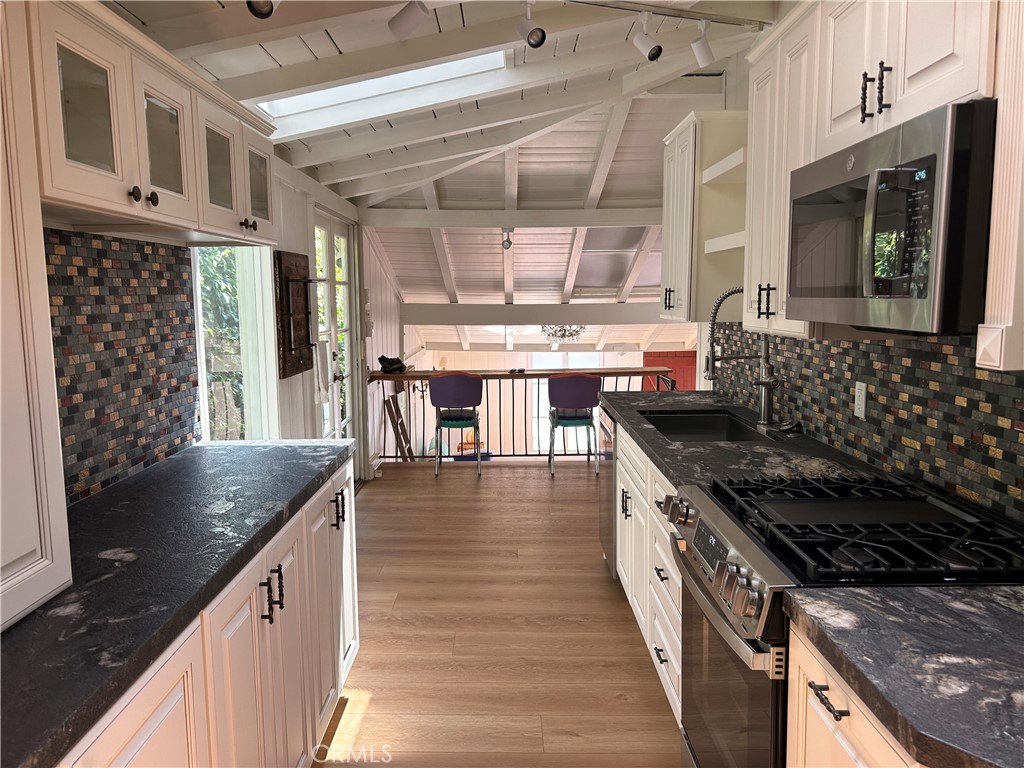 New kitchen with slide out storage and skylights - 422 Graceland Drive, Laguna Beach CA 92651 - photo 1