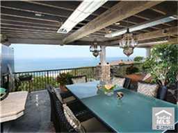Outdoor kitchen and covered deck with ocean views, full kitchen, BBQ, dining and living room. - 43 LAGUNITA Drive, Laguna Beach CA 92651 - photo 1