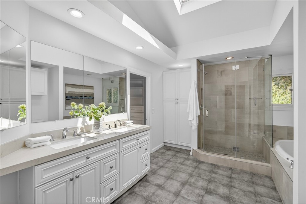 Bathroom in Primary Suite with standing shower and soaking tub - 431 Nyes Place, Laguna Beach CA 92651 - photo 28