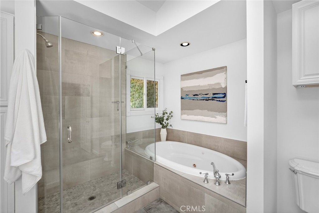 Bathroom in Primary Suite with standing shower and soaking tub - 431 Nyes Place, Laguna Beach CA 92651 - photo 30