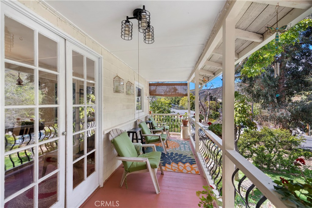 Enjoy the tranquil view and sounds of the canyon from the balcony - 437 Canyon Acres Drive, Laguna Beach CA 92651 - photo 1