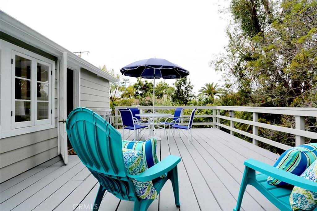 Spacious outdoor patio with gorgeous ocean, treetop, and neighborhood views. - 460 Saint Anns Drive, Laguna Beach CA 92651 - photo 1