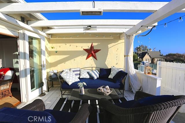 Light and Bright OUTDOOR/INDOOR living space. To the right on a clear day is a peek-a-boo ocean view! - 465 Monterey Drive, Laguna Beach CA 92651 - photo 1