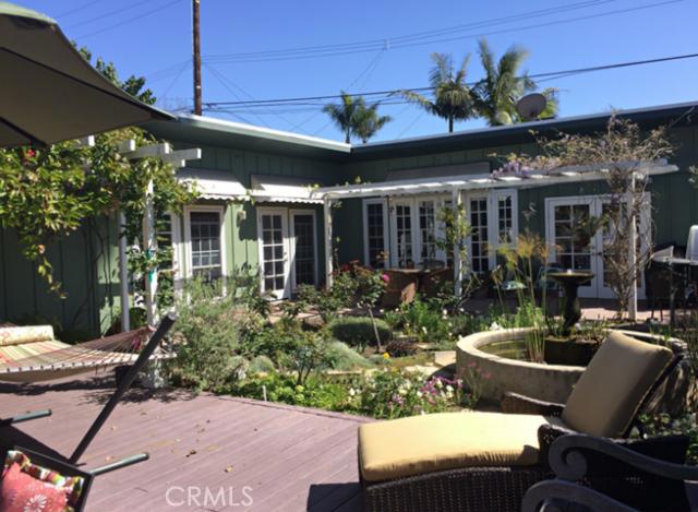 Backyard is a large garden area with fountain, fruit trees, lots of sitting areas for relaxing or entertaining. Most of - 480 Thalia Street, Laguna Beach CA 92651 - photo 1