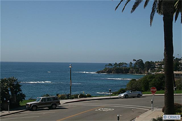 View up the coast from the balcony - 484 CLIFF Drive 9, Laguna Beach CA 92651 - photo 1