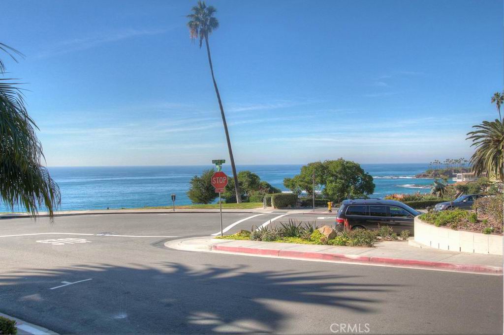 View of ocean and coastline taken from the condo's balcony. - 496 Cliff Drive 3, Laguna Beach CA 92651 - photo 1