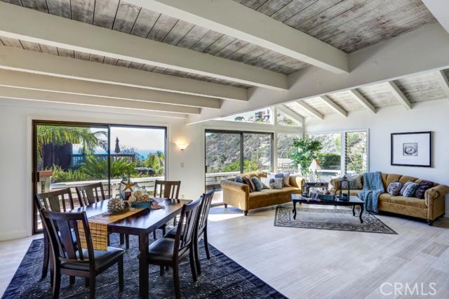 Living Room and Dining Room with new hardwood floors and ocean views - 499 Nyes Place, Laguna Beach CA 92651 - photo 1