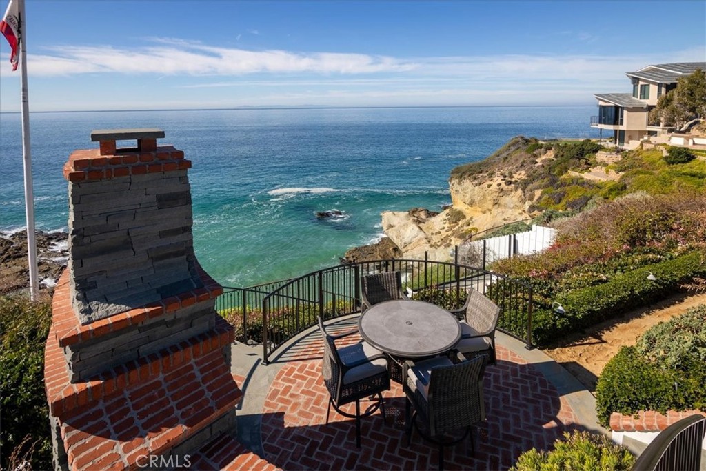 Al fresco dining area with cozy fieplace. - 50 N La Senda Drive, Laguna Beach CA 92651 - photo 50