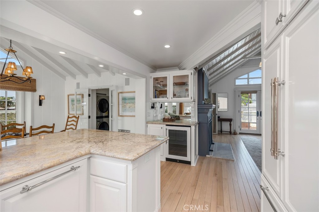 Looking out from kitchen into the living room and wet bar. - 501 Lombardy Lane, Laguna Beach CA 92651 - photo 11