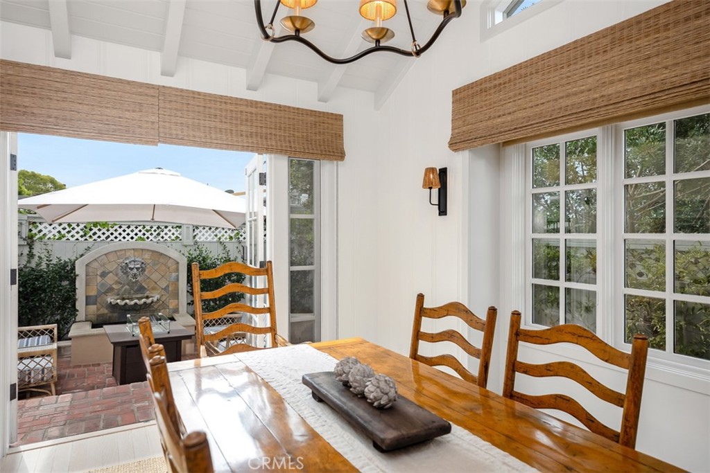 French doors lead out to a charming water feature perfect place to unwind after a long day. - 501 Lombardy Lane, Laguna Beach CA 92651 - photo 15