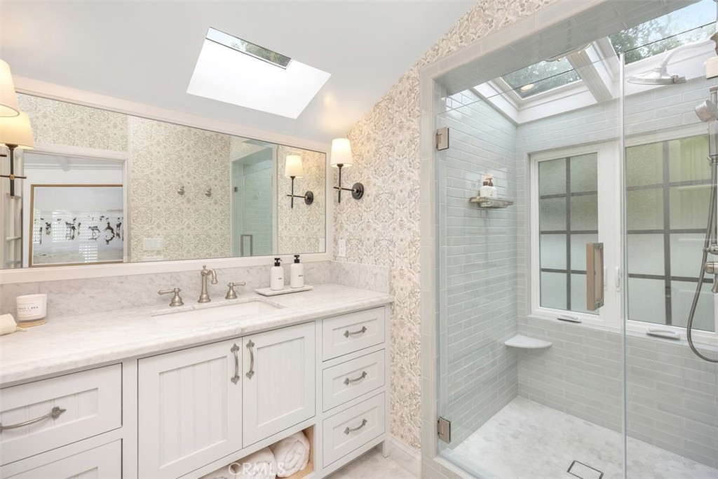 Another spa like bathroom in the primary suite with lots of natural light. - 501 Lombardy Lane, Laguna Beach CA 92651 - photo 21